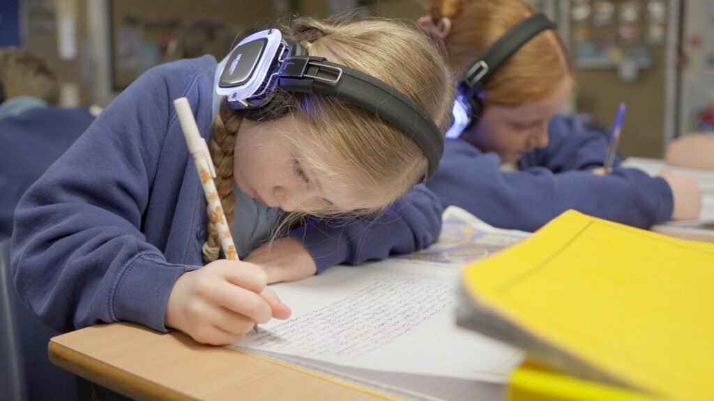 A child recording their story during a creative workshop.